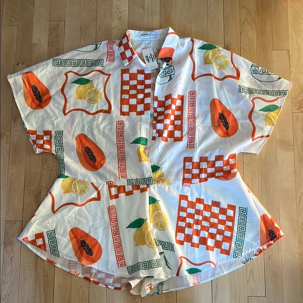 Vibrant White and Orange Jumpsuit with Playful Design